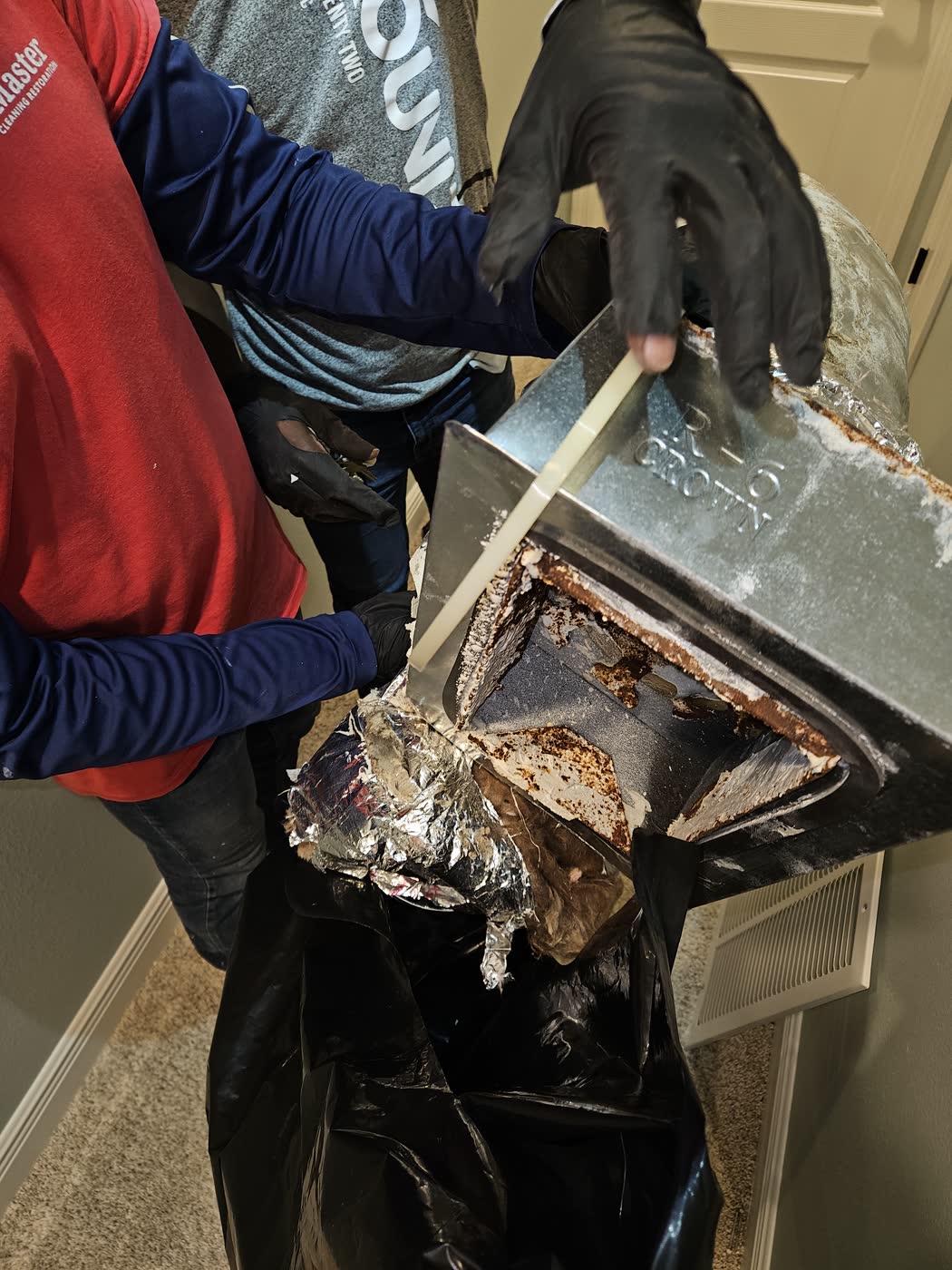 Technician removing affected ductwork